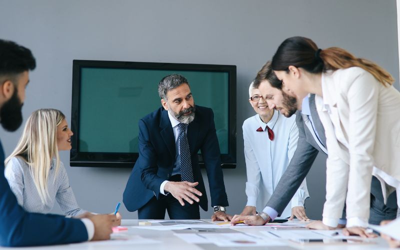 The export tax management team conduct a meeting to understand the tax treatment of IC-DISC dividends