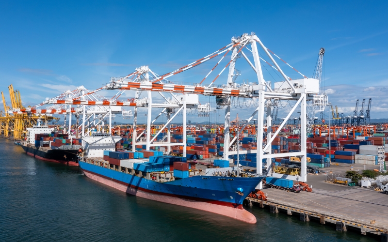 A large container ship docked at a port, illustrating the DISC tax structure's real-world application in shipping logistics.