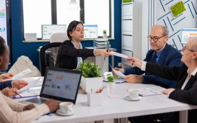 Business team discussing practical IC-DISC compliance and substantial transformation rules.