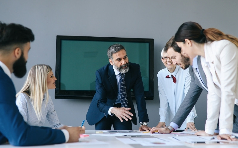 Business team evaluating export profitability rules and IC-DISC and marginal costing limitations