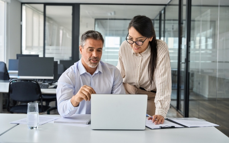 Professionals reviewing proposed adjustments during an IC-DISC audit