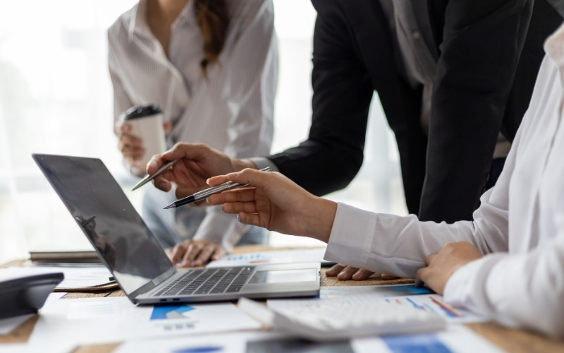 Professionals reviewing annual IC-DISC qualification requirements and compliance risks