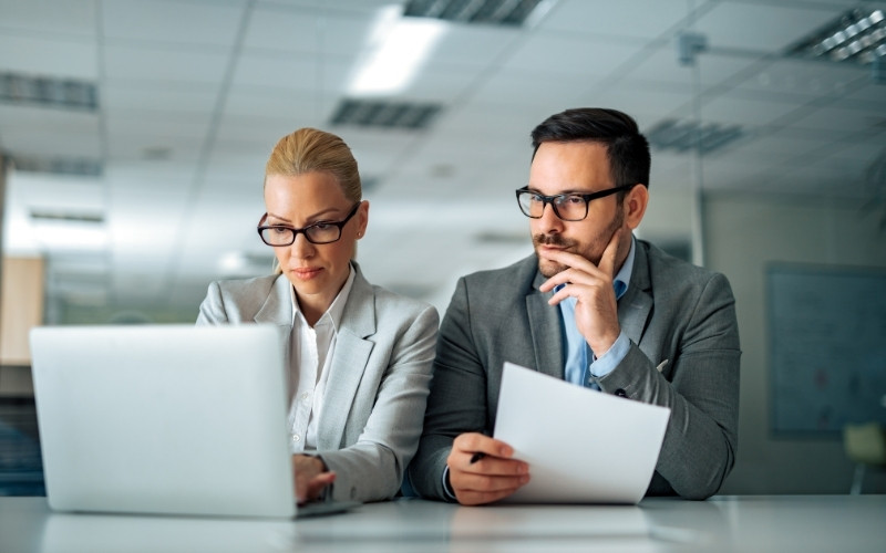 Professionals reviewing risks when an IC-DISC fails a qualification test
