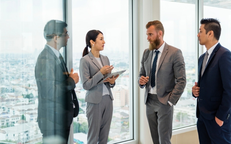 Business leaders discussing responsibility for IC-DISC risk management and compliance